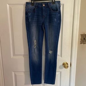 Women’s distressed mid-rise skinny jeans